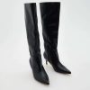 Bottes à talon en cuir bout pointu