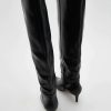 Bottes à talon en cuir bout pointu
